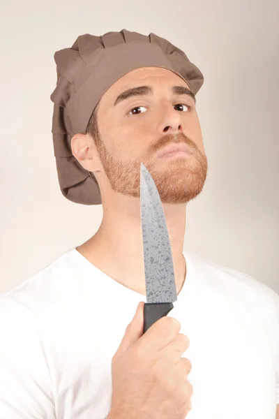 Šéfkuchař s nožem v ruce — Stock fotografie