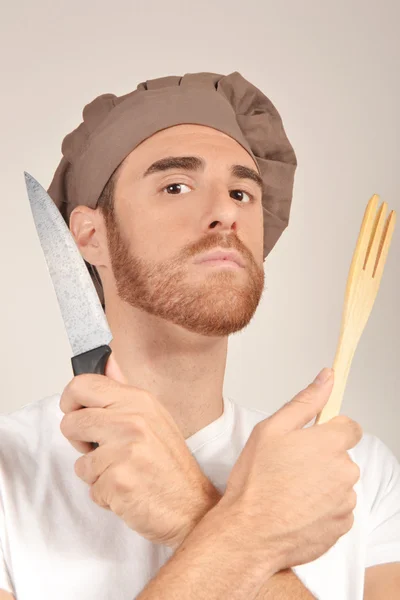 Cook with a knife and fork wooden hands — Stock Photo, Image