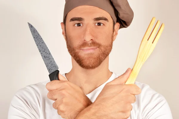 Готовить с ножом и вилкой деревянные руки — стоковое фото