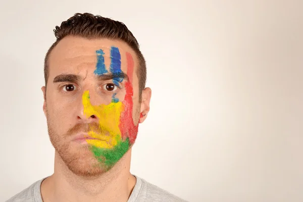 Young man with hand and face painted — Stock Photo, Image