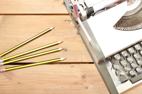 Typewriter and pencils — Stock Photo, Image