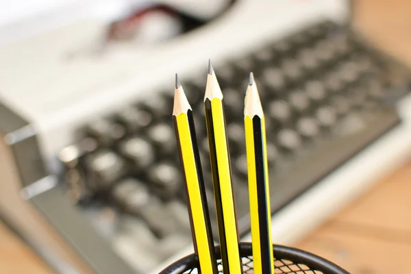 Typewriter and pencils — Stock Photo, Image