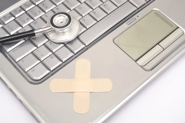 Laptop and stethoscope — Stock Photo, Image