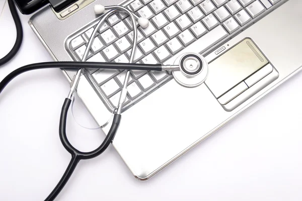 Laptop and stethoscope — Stock Photo, Image