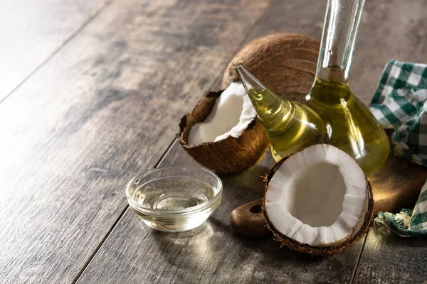 Coconut Oil Crystal Bottle Wooden Table Copy Space — Stock Photo, Image