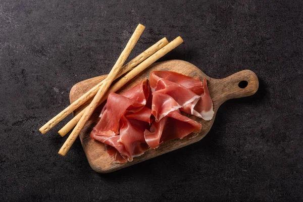 Spanish Serrano Ham Breadstick Black Background —  Fotos de Stock