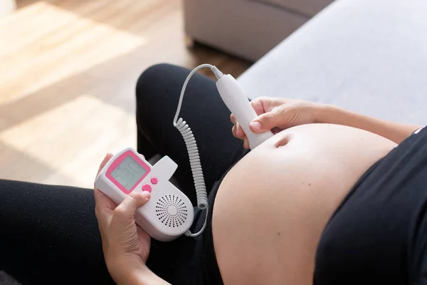 Pregnant Woman Fetal Doppler Listening Baby Heart Sitting Sofa Home — Stock Photo, Image