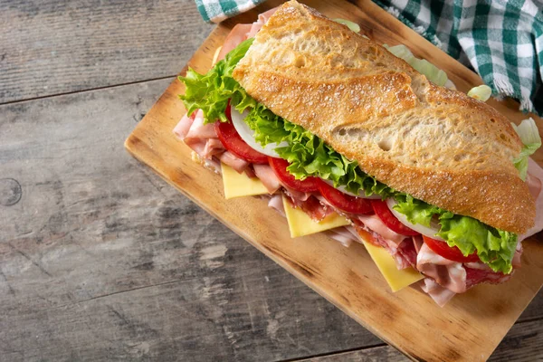 Submarine Sandwich Ham Cheese Lettuce Tomatoes Onion Mortadella Sausage Wooden — Foto Stock