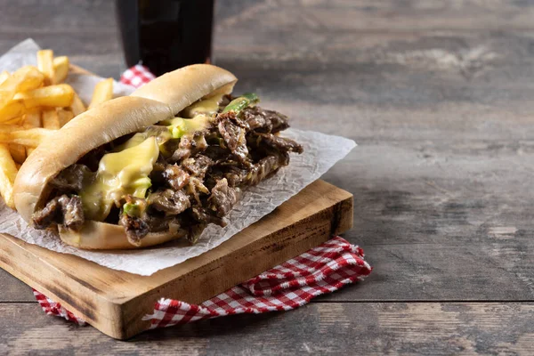 Philly Cheesesteak Sandwich Beef Cheese Green Pepers Caramelized Onion Wooden — Foto de Stock