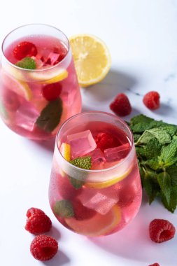 Raspberry lemonade drink on marble background