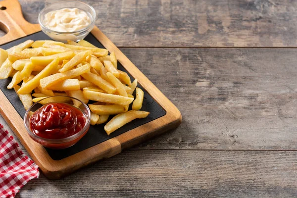 Fried Potatoes Ketchup Mayonnaise Wooden Table Copy Space — Stockfoto