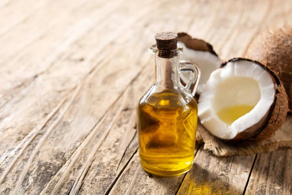 Coconut Oil Bottle Oil Wooden Table Copy Space — Stock Photo, Image
