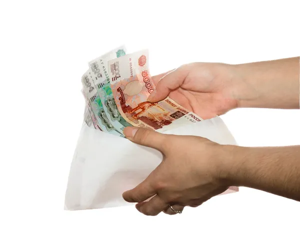 Women's hands reach envelope of cash fan — Stock Photo, Image