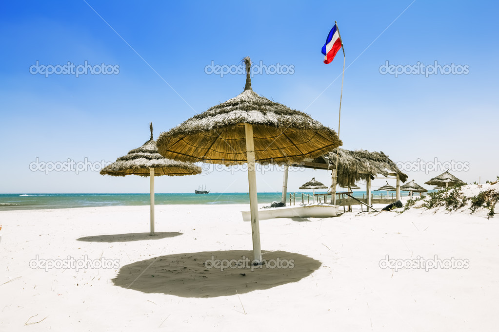 Sandy beaches with parasols on the Mediterranean in Tunisia