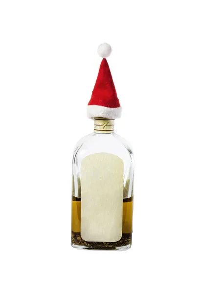 Little Santa's Cap on the bottleneck with strong alcohol on a wh — Stock Photo, Image