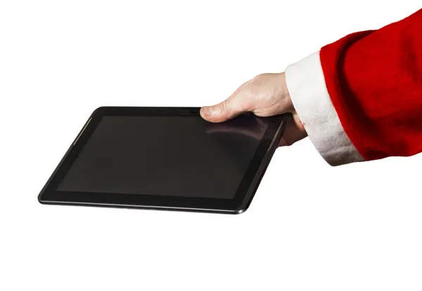Ręka Świętego Mikołaja z komputerem typu tablet na białym tle — Zdjęcie stockowe