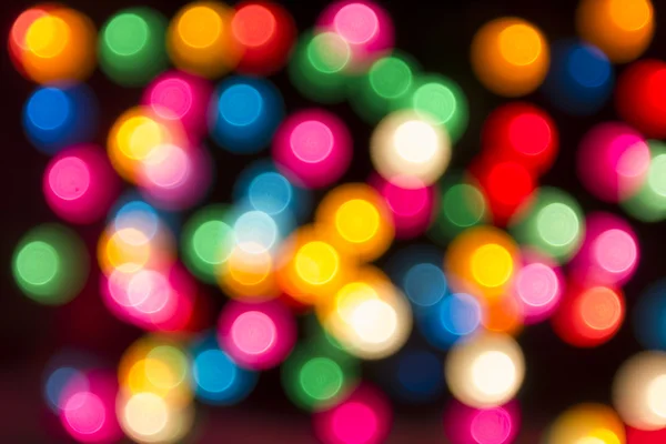 Round multicolor bokeh on a black background — Stock Photo, Image