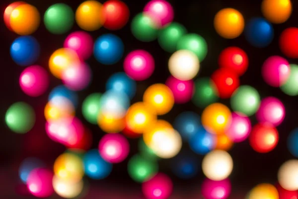 Round multicolor bokeh on a black background — Stock Photo, Image