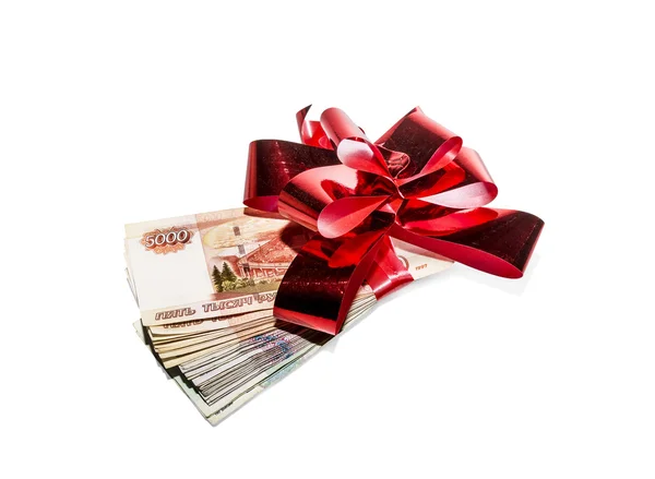 Un paquete de billetes atado arco de regalo —  Fotos de Stock
