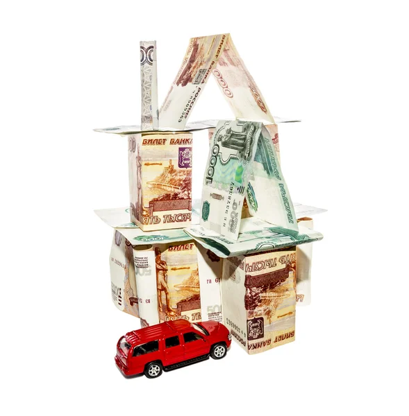 House made of banknotes with a toy car — Stock Photo, Image