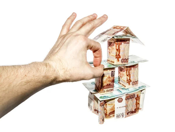 Handen gör ett klick på huset av sedlar — Stockfoto