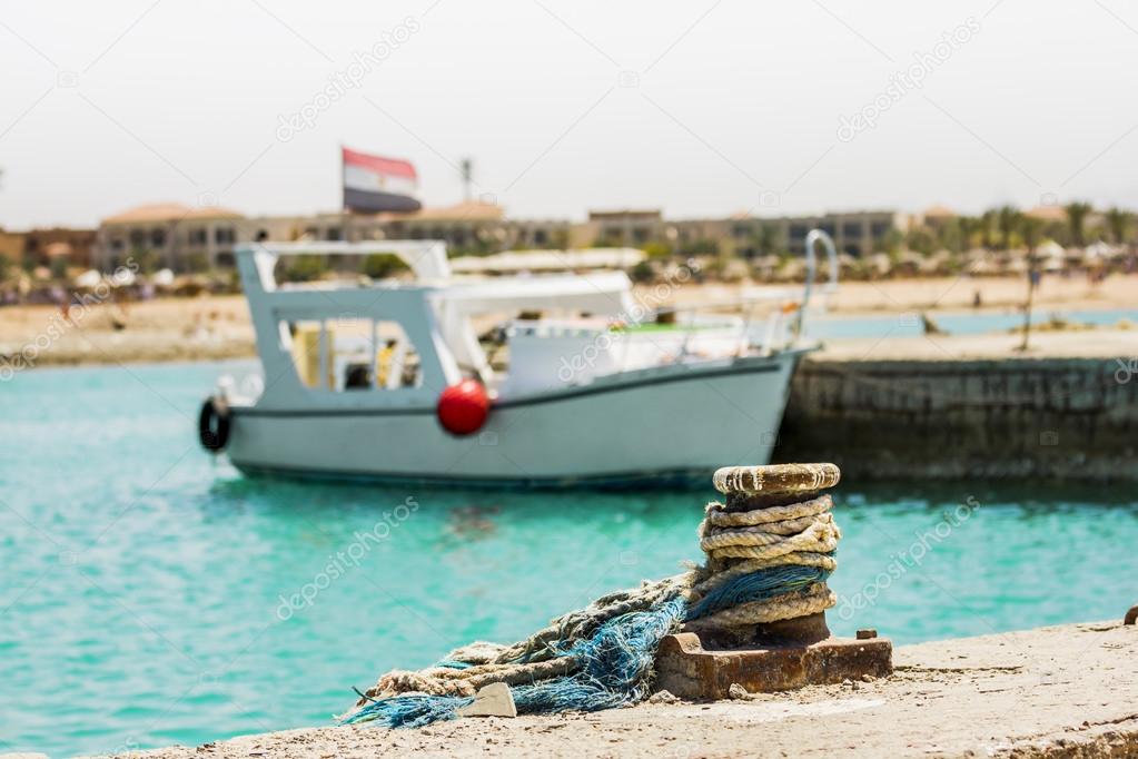 The yacht with the Egyptian flag docked at a pier in the Red Sea