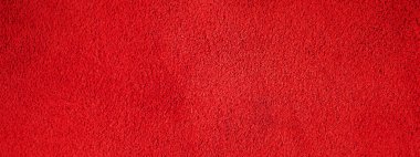 Kırmızı kadife desenli bir makro fotoğraf. Kırmızı süet deri dokusu..