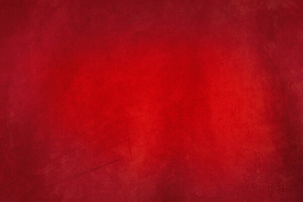 Красный фон. Макрофотография красной замшевой кожи с небольшими складками.