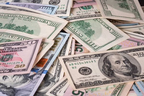 Многие американские доллары в качестве фона. Бизнес, богатство.