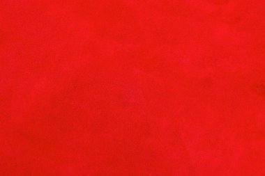 Kadife kırmızısı arka plan yakın plan fotoğrafı. Kırmızı süet hakiki deri arka plan.