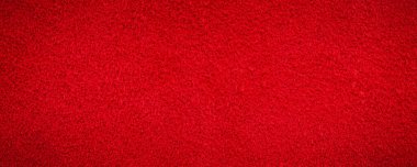 Kadife kırmızısı arka plan yakın plan fotoğrafı. Kırmızı süet hakiki deri arka plan.