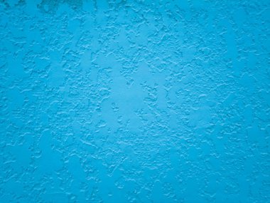 Texture and background of blue decorative plaster on a cement wall.