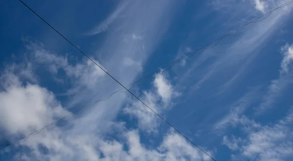 Beautiful Sky Background Unusual Cirrus Clouds Electric Wires Blue Sky — Stok fotoğraf
