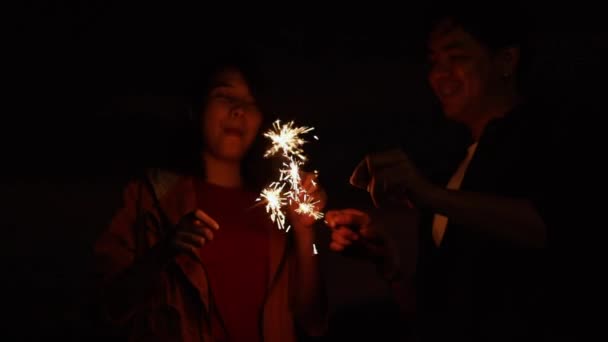 Asian Couple Campers Holding Sparklers Dancing Celebrating New Year Sunset — Stock Video
