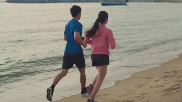 Fitness Couple Sports Running Beach Beautiful Sunset Sports Training Healthy — Stock Video