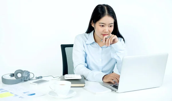 Working Asian women feel stressed, dismal tired from work, migraine headaches from hard work while working at the office.