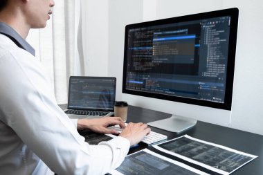 Programmer, Man working with computer programming, professional development, and coding technology, working on high-quality visual software development websites.