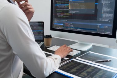 Programmer, Man working with computer programming, professional development, and coding technology, working on high-quality visual software development websites.