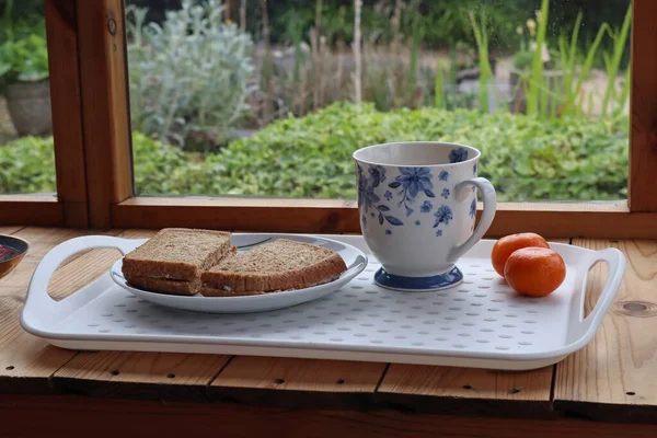 A lunchtime snack in a garden shed during a welcome break from work in the garden