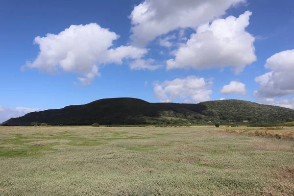 Dramatic Clouds Rounded Hill Stand Field Crops Porlock Salt Marshes — Stock Photo, Image