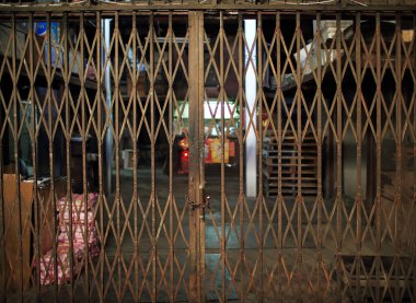 Asian rustiness chinese traditional gate or folding doors in the shop with the vintage style - architectural structure in Yau Ma Tei Wholesale Fruit Market clipart