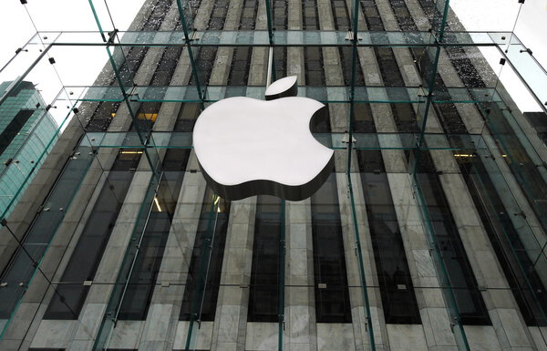 NEW YORK APRIL 5: the Apple Store with big logo under bad weather in Fifth Avenue in New York on 5 april 2012. the store is designed as the exterior glass box above the underground display room