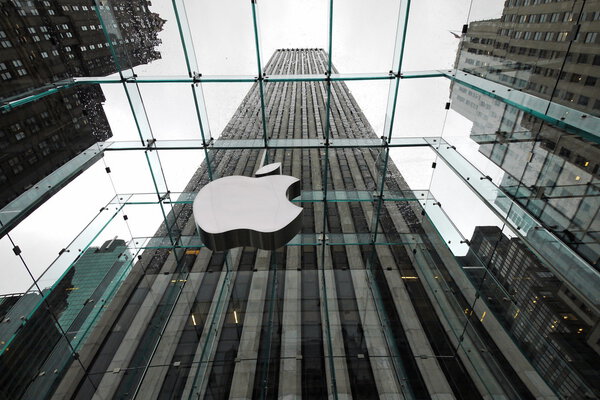 NEW YORK APRIL 5: the Apple Store with big logo under bad weather in Fifth Avenue in New York on 5 april 2012. the store is designed as the exterior glass box above the underground display room