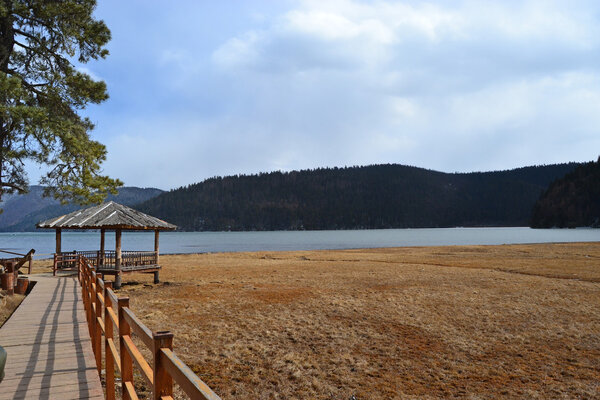 A chinese Arbour near the lakeside in pudacuo national park at Shangri La Country, Yunnnan province