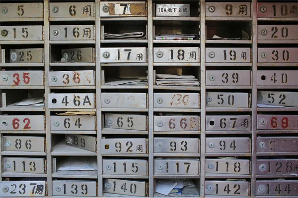 Old vintage metal made, ruined traditional chinese empty or full mailboxes — Stock Photo, Image
