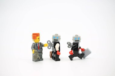 Hong Kong - July 11 2022: Man help to wind up the clockwork robot