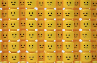 Hong Kong - July 25 2022: thousand of happy face head have been built as the wall