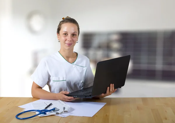 Young doctor and computer — Stock Photo, Image