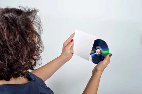 Young woman holding a CD and its case — Stock Photo, Image