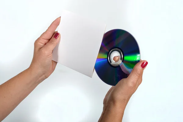 Young woman liking a CD-ROM and its dress handkerchief — Stock Photo, Image